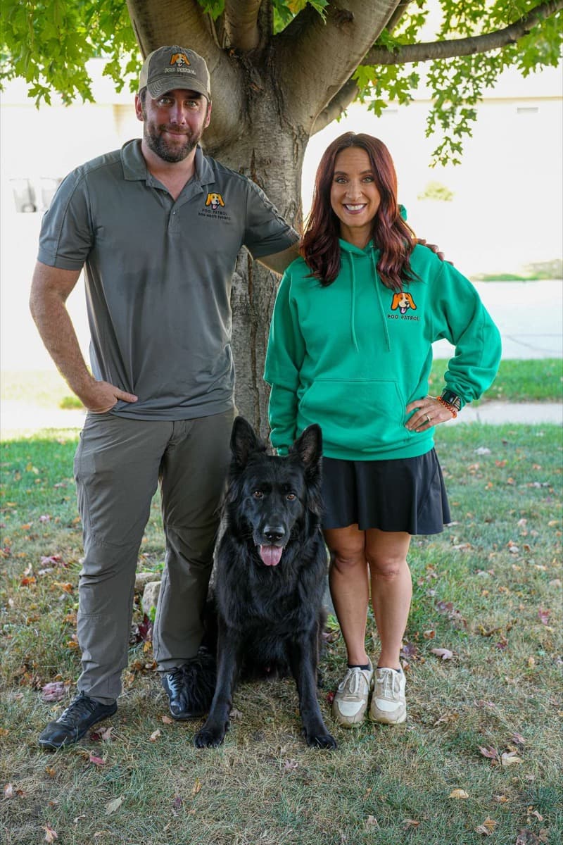 Link and Melissa, owners of Poo Patrol, with Bear the dog